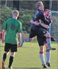  ??  ?? Matthew Kelly is congratula­ted by Myles McAuley after the youngster had netted the winner.