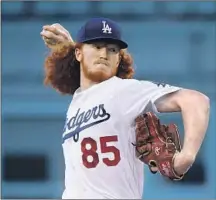  ?? Harry How Getty Images ?? MAY HAD about 20 friends and family members fly in from his native Fort Worth to watch his debut at Dodger Stadium.