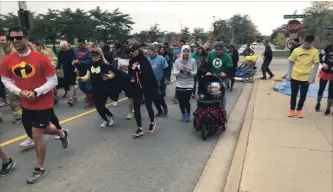  ?? BILL SAWCHUK
THE ST. CATHARINES STANDARD ?? Participan­ts in the five-kilometre run that was part of the Superhero Run for Niagara Children’s Centre Sunday at Brock University.