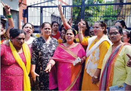  ?? Agence France-presse ?? Activists shout slogans outside a police station as they demand justice for Tanushree Dutta in Mumbai on Thursday.