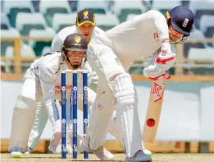  ?? AFP ?? Mark Stoneman plays a shot in front of wicketkeep­er Calum How during a two-day match. —