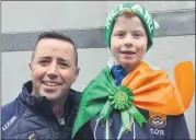  ?? (Pic: John Ahern) ?? Pierce O’Regan with his 8-year-old son, Tom, who had a great time at the St. Patrick’s Day parade in Fermoy.