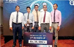  ??  ?? 2nd Runner – UpPeoples Bank receiving their award and prize from the Chief Guest Dr. Prasad Medawatte, the GCEO of Lanka Hospitals PLC and Mr. Pradeep Edward, the President of SLIM.