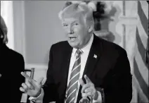  ?? ASSOCIATED PRESS ?? PRESIDENT DONALD TRUMP GESTURES AS HE ANSWERS a question regarding the ongoing situation in North Korea, on Friday at Trump National Golf Club in Bedminster, N.J.