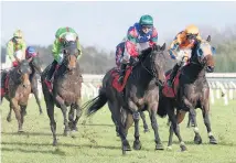  ?? Picture / Trish Dunell ?? Mr Luigi ( green cap) is better than most of those facing him at Tauranga today.