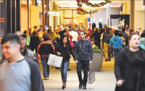  ?? Hearst Connecticu­t Media file photos ?? Shoppers look for Black Friday deals at the Westfield Trumbull mall in Trumbull in 2016. Below, shoppers at the Danbury Fair mall on Black Friday in 2016.