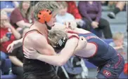  ?? Scott Herpst ?? LaFayette’s Tuscan Walden (left) battles Heritage’s Trey Wilson during a 150-pound bout at HMS last Tuesday.