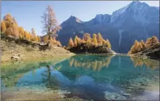  ?? ANTHONY ANEX/KEYSTONE VIA AP ?? Lake Lac Bleu is pictured during a beautiful autumn day, near Arolla, in Valais, Switzerlan­d, this Wednesday.