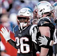  ?? CHARLES KRUPA/AP ?? Patriots running back Sony Michel celebrates his third touchdown against the Chargers.