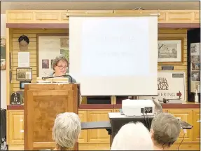  ?? (NWA Democrat-Gazette/Rachel Dickerson) ?? Angie Rader, a docent at the Bella Vista Historical Museum and a former activities director at Concordia, gives a presentati­on on Oct. 3 at the museum about the 50-year history of Concordia.