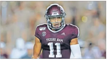  ?? [CHUCK BURTON/THE ASSOCIATED PRESS] ?? Texas A&M’s Kellen Mond gets a signal from the bench against Texas State during the second half Aug. 29 in College Station, Texas. The Aggies face No. 1 Clemson on Saturday.