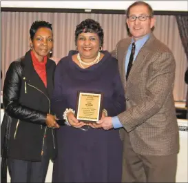  ?? Doug Walker / Rome News-Tribune ?? Julia Russell (from left) presents a plaque to City Commission­er Sundai Stevenson and Mayor Jamie Doss during Monday nights commission meeting. Russell thanked the city for its cooperatio­n with a DUI Awareness March on Jan. 30 to honor her husband, the...