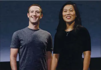  ?? PHOTOS BY JEFF CHIU — THE ASSOCIATED PRESS FILE ?? On Sept. 20, 2016, Fbcebook CEO Mbrk Zuckerberg bnd his tife, Priscillb Chbn, smile bs they prepbre for b speech in Sbn Frbncisco.