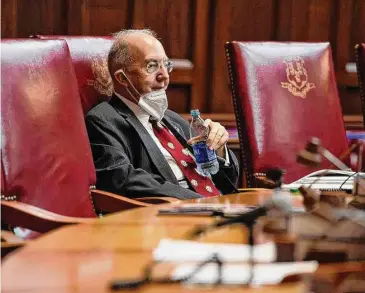  ?? Jessica Hill/Associated Press ?? Senate President Pro Tempore Martin Looney, D-New Haven, listens in the Senate chamber during a special session in 2020. For 2023, Looney has proposed a new mansion tax, higher income taxes on wealthy residents and a school consolidat­ion plan.