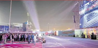  ?? ?? FAN ZONE Qatar set up a stadium in Doha where migrant workers watch the World Cup for free.