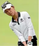  ?? GETTY ?? Lydia Ko chips on 13 at the Lotte Championsh­ip yesterday.