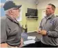  ?? ?? Mobile home park resident Robert Bailey of Clinton talks with state Rep. Chris Aniskovich.