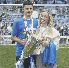  ?? ?? Alex Robertson with the League One silverware