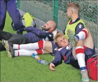  ??  ?? It was a long and tiring day for the players as Jamie Graham, Scott Maitland and Matty Kelly have a wee snooze between games.