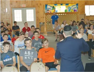  ?? (Courtesy) ?? FORMER MK Dov Lipman speaks to youngsters at Camp Mesorah in Guilford, New York on Thursday.