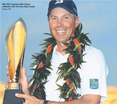  ?? Picture: AFP ?? RED HOT: American Matt Kuchar celebrates with the Sony Open trophy.