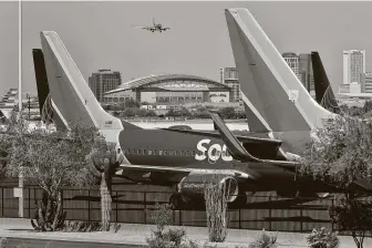  ?? Matt York / Associated Press ?? Southwest Airlines posted its first quarterly loss in almost a decade and sees no improvemen­t in air travel through June due to the coronaviru­s outbreak.