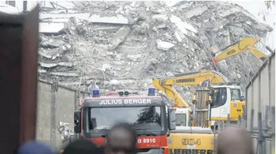  ?? AP ?? A view of the rubble of the collapsed 21-story apartment building under constructi­on in Lagos, Nigeria, November 2, 2021.