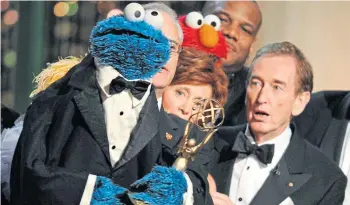 ?? ?? ORIGINAL: Bob McGrath, right, with the Cookie Monster at the Emmy Awards.