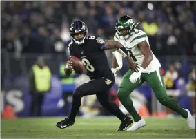  ?? GAIL BURTON - THE ASSOCIATED PRESS ?? File-This Dec. 12, 2019, file photo shows Baltimore Ravens quarterbac­k Lamar Jackson running during the first half of an NFL football game in Baltimore.