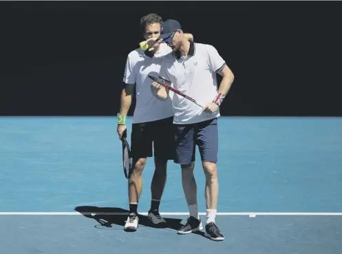  ??  ?? Jamie Murray, right, and Bruno Soares talk tactics during their semi-final defeat by Joe Salisbury and Rajeev Ram in Melbourne