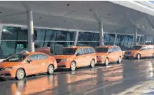  ?? ROSIE MULLALEY/THE TELEGRAM ?? Taxis were lined up outside the arrivals section of St. John’s Internatio­nal Airport Wednesday morning, the first day the airport was open since a monster storm hit the region last Friday. It was also the first time taxis were permitted to operate regularly since the state of emergency was issued.