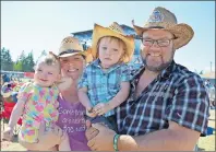  ?? MAUREEN COULTER/THE GUARDIAN ?? Brenda and Carl Moore with their two children, Frankie, 1, and Parker, 2.5, on Sunday at the Cavendish Beach Music Festival. Brenda, who is five months pregnant, was also pregnant with Frankie and Parker in previous years at the festival.