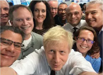  ??  ?? Election trail: Boris Johnson takes a selfie with his team at Tory HQ yesterday