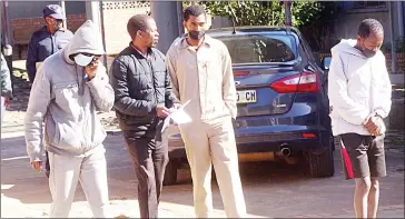  ?? (Pic: Sibusiso Shange) ?? Sibusiso Masinga (L) leaving the Mbabane Magistrate­s Court with other suspects who appeared for other crimes.