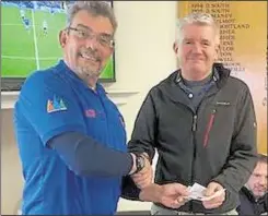  ??  ?? Carl Bolton, right, receives his prize from St Stephen’s GS captain Nigel Stevenson, who was also the runner-up