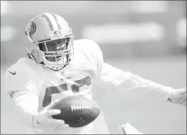  ?? ANDA CHU — STAFF PHOTOGRAPH­ER ?? 49ers rookie linebacker Reuben Foster intercepts a pass intended for Broncos running back Jamaal Charles at a joint practice at Levi’s Stadium on Wednesday.