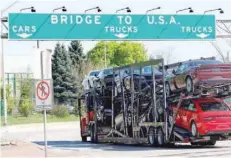  ?? — Reuters ?? A truck loaded with cars made in Canada enters the United States border in Washington, in this file photo.