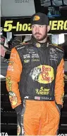  ?? AP Photo/Larry Papke ?? ■ NASCAR Monster Energy Cup Series driver Martin Truex Jr. stands in the garage area before practice Saturday for today’s race at Texas Motor Speedway in Fort Worth, Texas.