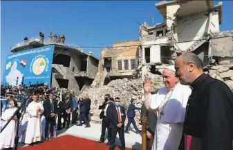  ?? Vatican Media / AFP / Getty Images ?? Pope Francis arrives at a square in Mosul surrounded by churches nearly destroyed in the war to oust Islamic State fighters from the city. “Hope is more powerful than hatred,” he said.
