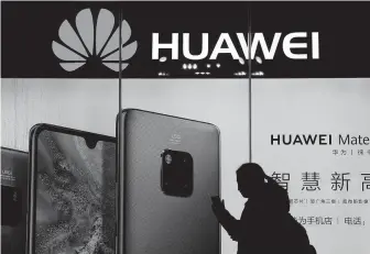  ?? Andy Wong / Associated Press ?? China’s government has accused Washington of trying to block its industrial developmen­t after Vice President Mike Pence said Chinese tech giant Huawei and others are a security threat.