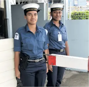  ?? Photo: Simione Haravanua ?? Women sailors Karolina Leba (left) and Sereima Naiqovu guarding the main gate at the Fijian Navy Headquarte­rs on July 13, 2018.