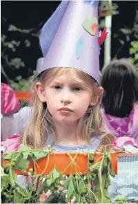  ??  ?? Hat’s nice: This little princess on the Cross Farm Infant School float looked serious despite the school winning the best under-12s’ float.