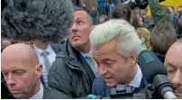  ?? AP ?? Geert Wilders (second right) talks to media during an election campaign stop in Spijkeniss­e, near Rotterdam. —