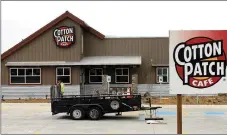  ?? Michael Burchfiel/Herald-Leader ?? Crews put the finishing touches on the Cotton Patch Cafe late last week. The Texas-based restaurant will open its doors Dec. 29.