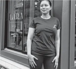  ?? RYAN TAPLIN • THE CHRONICLE HERALD ?? Lara Cusson, owner of Cafe Lara, poses outside her Agricola Street cafe last year. Cusson was happy about being able to reopen the cafe, but it has been closed again as a result of the recent provincial lockdown.