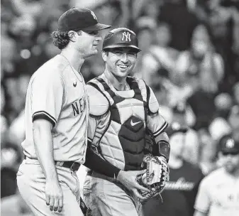  ?? Godofredo A. Vásquez / Staff photograph­er ?? Gerrit Cole, celebratin­g with catcher Kyle Higashioka, allowed three hits with 12 strikeouts in the complete-game win against his former team. Cole has won 11 straight games at Minute Maid Park.