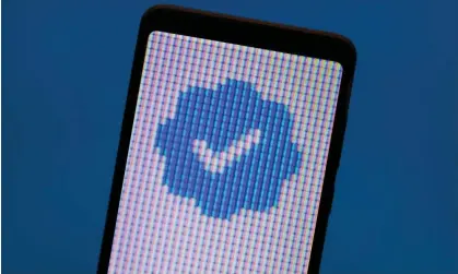  ?? ?? For a morning, Elon Musk replaced Twitter’s blue verificati­on check marks with gray ‘official’ check marks. Photograph: Priyanka Naskar/ Alamy