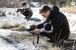  ?? RYAN BRENNECKE The Bulletin/TNS ?? Alex Laakmann and his friend Eli Zatz recently took pictures of ice crystals in a puddle of water near Bill Healy Bridge in Bend, Ore.