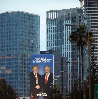  ?? (Reuters) ?? AN ELECTION poster supporting Benjamin Netanyahu in Tel Aviv.