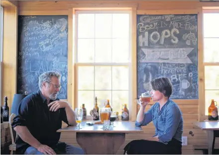  ?? NATHAN ROCHFORD/SALTWIRE NETWORK ?? Retired fisherman and founder of Moth Lane Brewing Eric Wagner chats with Julia Cook during a recent afternoon.